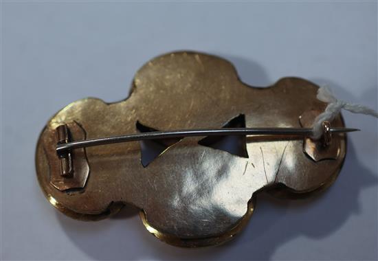 Four late 17th century gold mounted Stuart crystal oval slides later mounted together as a brooch, width 54mm.